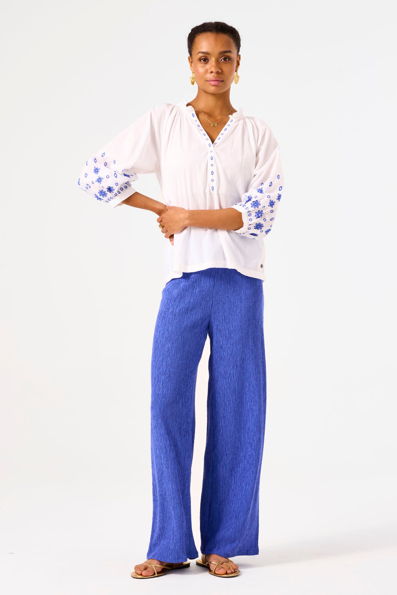 Garcia Ladies white top with blue embroidery detail.